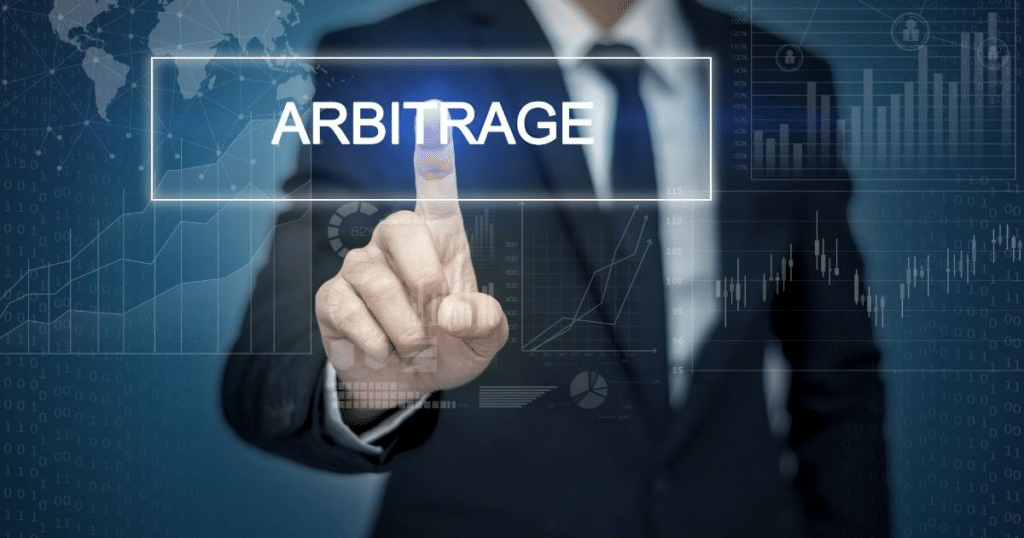 businessman points his finger at the word Arbitrage